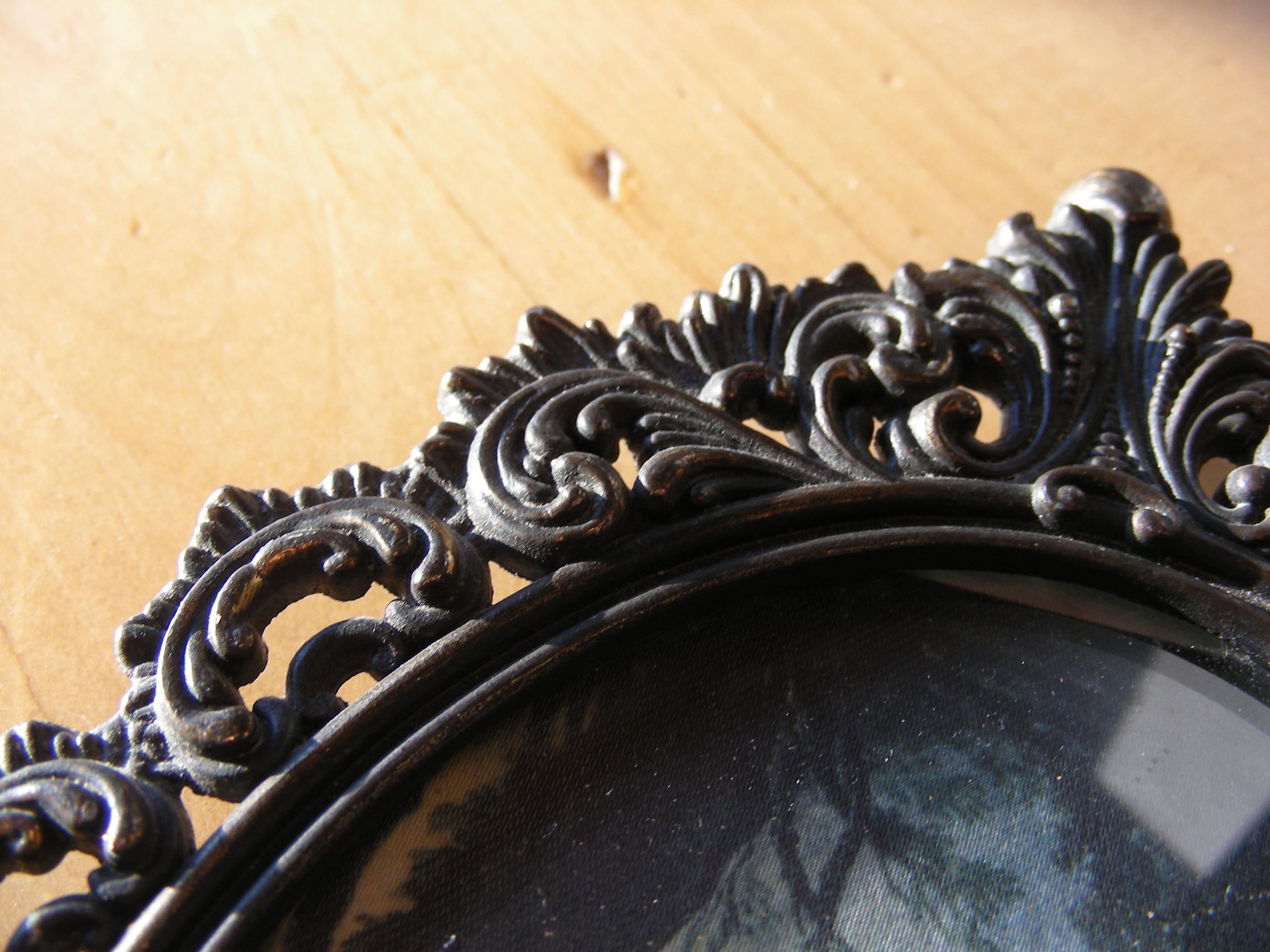 Vintage metal frame with curved, convex glass