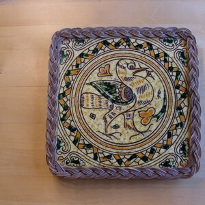 Large vintage wicker and tile trivet with bird motif