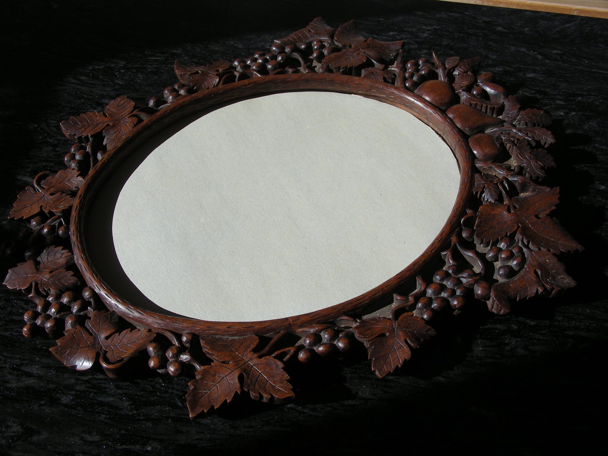Beautifully carved, vintage, oak, oval mirror or picture frame, grapes and fruit, Brienz Switzerland