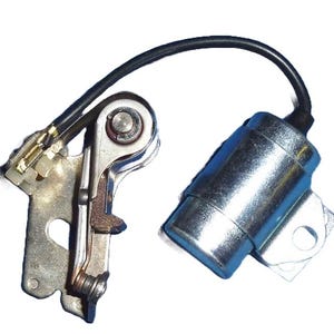 May include: A silver condenser and a silver ignition point with a black wire attached. The condenser has a silver metal cap and a silver metal base.