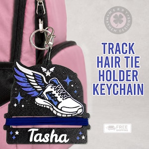 May include: A black glittery keychain featuring a white and blue winged running shoe graphic, a horizontal blue hair tie, and the name Tasha in white script. The text TRACK HAIR TIE HOLDER KEYCHAIN is visible on the right side of the image.