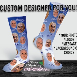 May include: Two pairs of custom designed socks with a blue background and a repeated pattern of faces and the word "FALCONS". The text "CUSTOM DESIGNED FOR YOU!" is at the top of the image. The text "*YOUR PHOTOS *LOGOS *MESSAGE *BACKGROUND COLOR CHOICE" is on the right side of the image.