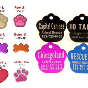May include: A collection of pet ID tags in various shapes and colors, including paw prints, bones, and hearts. Some tags feature text like "Capital Canines" and "Rescue Dog," along with contact information. Sizes are listed in inches.