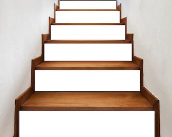 May include: A set of white stair treads with a wood base. The treads are designed to cover the existing steps and add a modern touch to the staircase.