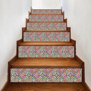 May include: Wooden staircase with decorative, colorful patterned risers. The pattern features overlapping circles in shades of pink, blue, green, orange, and purple. The steps are made of dark wood, creating a contrast with the vibrant design.