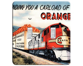 May include: A vintage illustration of a red train carrying a boxcar full of oranges. The train is labeled "Santa Fe" and the boxcar reads "Southern California". The text above the train reads "Sending you a carload of Oranges".