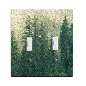May include: A light switch cover with a forest scene. The cover has two toggle switches labeled "OFF".