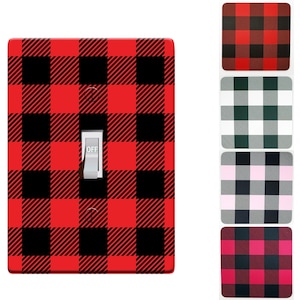May include: A red and black buffalo plaid light switch cover with the word "OFF" on the switch.