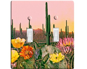 May include: A light pink background with a desert scene featuring cacti, flowers, and two light switch covers with the word "OFF" printed on them.