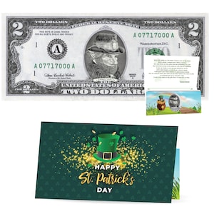 May include: A green and gold Happy St. Patrick's Day card with a shamrock and a leprechaun hat. The card is folded in half and has a green background with gold glitter.