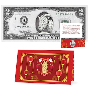 以下が含まれることがあります： ヤギが描かれた2ドル札。"The Year of the Goat"の文字と、ヤギのイラストと中国の提灯が描かれた赤い封筒が写っています。