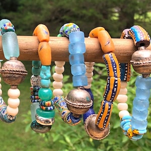 Bone and African Krobo bead bracelets Ghana recycled glass powdered glass Ethiopian Silver hippie boho festival tribal jewelry trade beads
