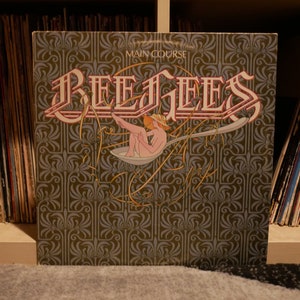 Vinilo vintage: Bee Gees - Plato principal - Vinilo LP - RSO - 1975 (con los éxitos Jive Talkin', Wind of Change y más)