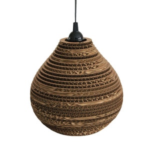 May include: A brown cardboard pendant light fixture shaped like a teardrop. The light fixture is made of many layers of cardboard, creating a textured and unique design.