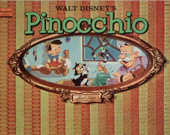 May include: A vintage record album cover featuring a colourful illustration of Pinocchio, Geppetto, and Figaro from the Disney movie Pinocchio. The cover has a gold frame and a striped background.