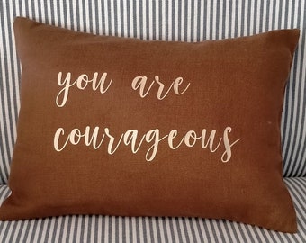 Teal and Coco Collection - Linen Cushion Small - Rectangular - 28 x 20 cm with the words 'You are courageous' in gold lettering