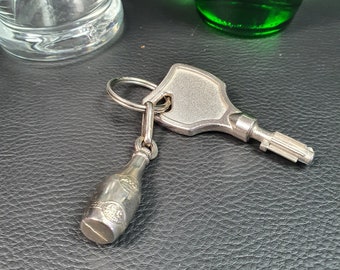 PERRIER | Silver plated promotional key ring in the shape of a PERRIER bottle | French vintage advertisement 1960