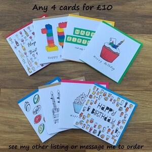 May include: Assortment of colourful birthday cards with various designs, including a cupcake, a stack of building blocks, a musical note, and a glass of wine. The text "Any 4 cards for &pound;10" is at the top of the image.