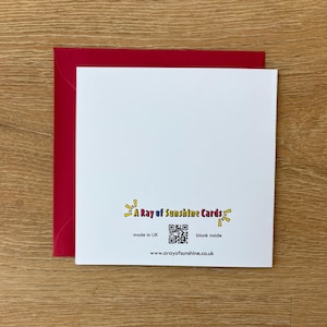 May include: A white greeting card with a red envelope. The card has the text "A Ray of Sunshine Cards" and a QR code. The card is blank inside and made in the UK. The website address is also included.