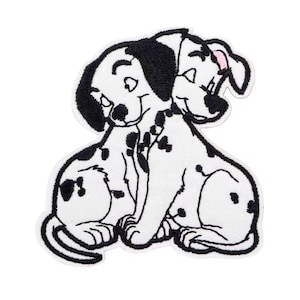 May include: Embroidered patch featuring two Dalmatian dogs, one with a black ear and the other with a pink ear. The dogs are white with black spots and are hugging each other. The patch has a white border and is on a white background.