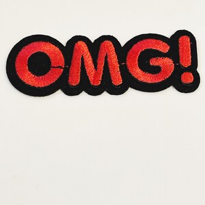 May include: Red embroidered "OMG!" patch with black outline.