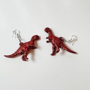 Rot glitzernde Dinosaurier Ohrringe Tyrannosaurus Spaß Neuheit Ohrringe Sparkly Glam Paläontologe Geschenk Schmuck Hoop Ohrdraht Tropfen baumeln