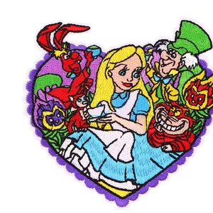 May include: Embroidered patch featuring Alice in Wonderland characters in a heart shape. Alice is in a blue dress, surrounded by the Mad Hatter, Cheshire Cat, and the White Rabbit. The patch has a purple scalloped border.