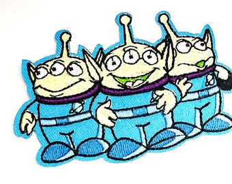 Alien Embroidered Iron On Patch: Novelty Animation Applique (3.5 x 2 inches)