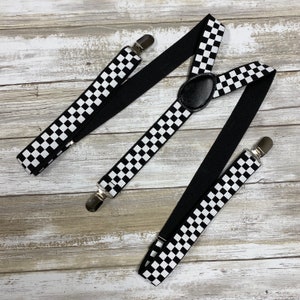 May include: Black and white checkered suspenders with black elastic straps and silver clips.