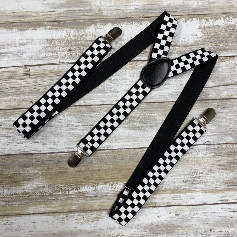 May include: Black and white checkered suspenders with black elastic straps and silver clips.