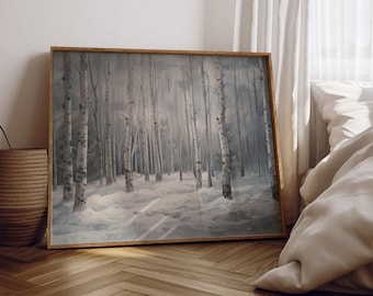 May include: A framed print of a snowy birch forest with a path leading through the trees. The print is in a light wood frame and is hanging on a white wall.