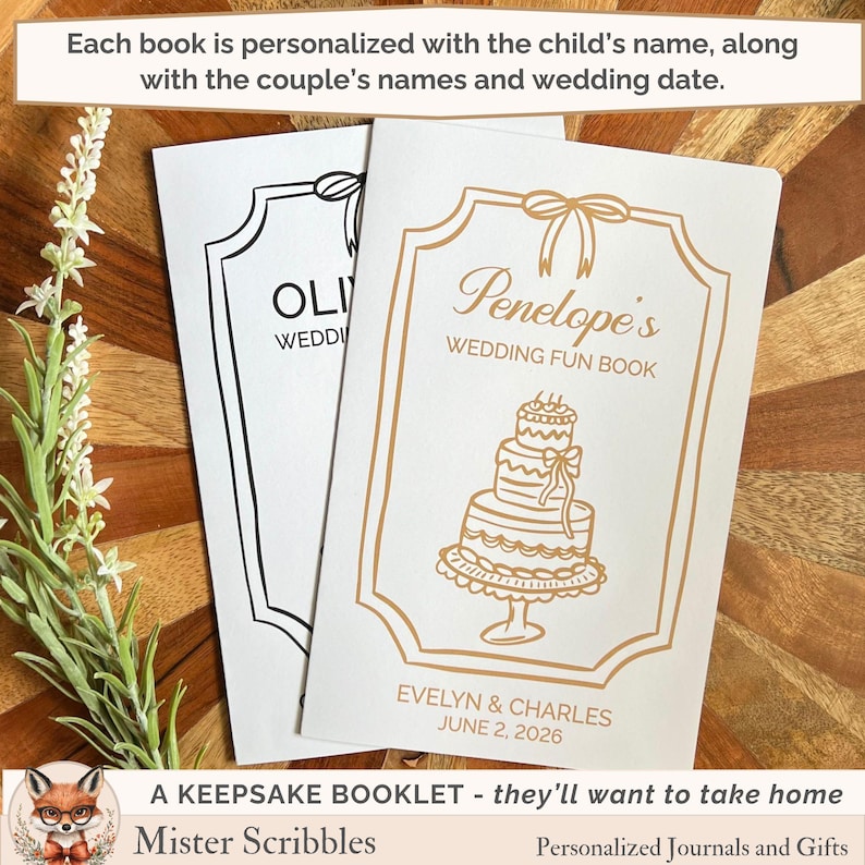 May include: Two white paper booklets with gold and black line art illustrations. The front booklet features a gold frame, a three-tiered cake, and the text Penelope's WEDDING FUN BOOK, EVELYN & CHARLES, JUNE 2, 2026. The second booklet shows a black frame.