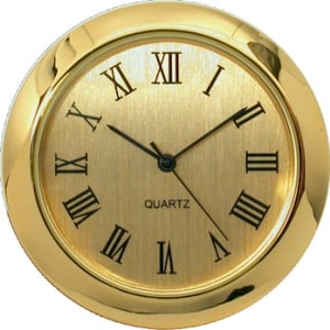 May include: Gold-toned clock face with Roman numeral hour markers and a brushed gold finish. The clock face reads "QUARTZ".