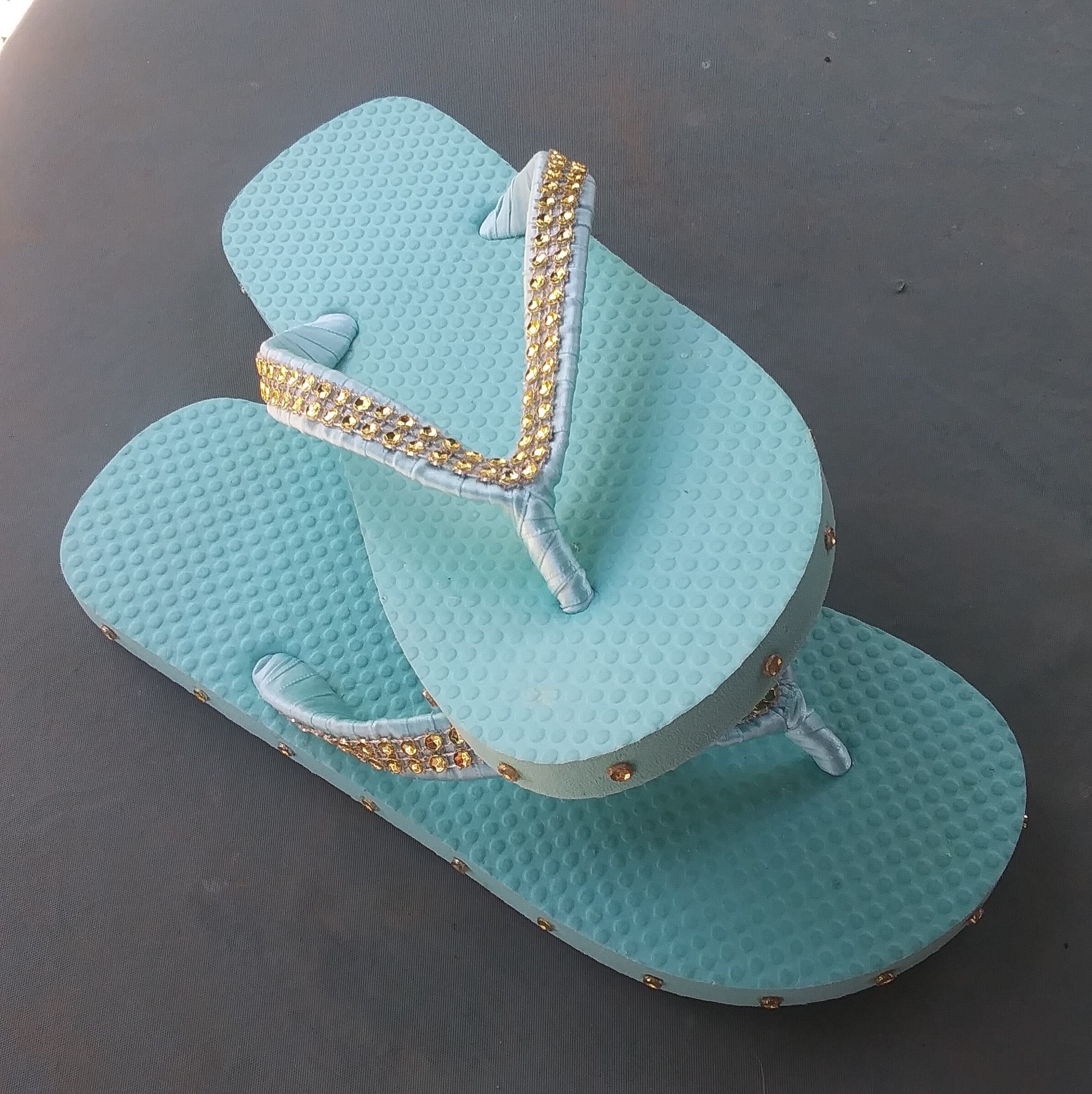 aqua colored flip flops