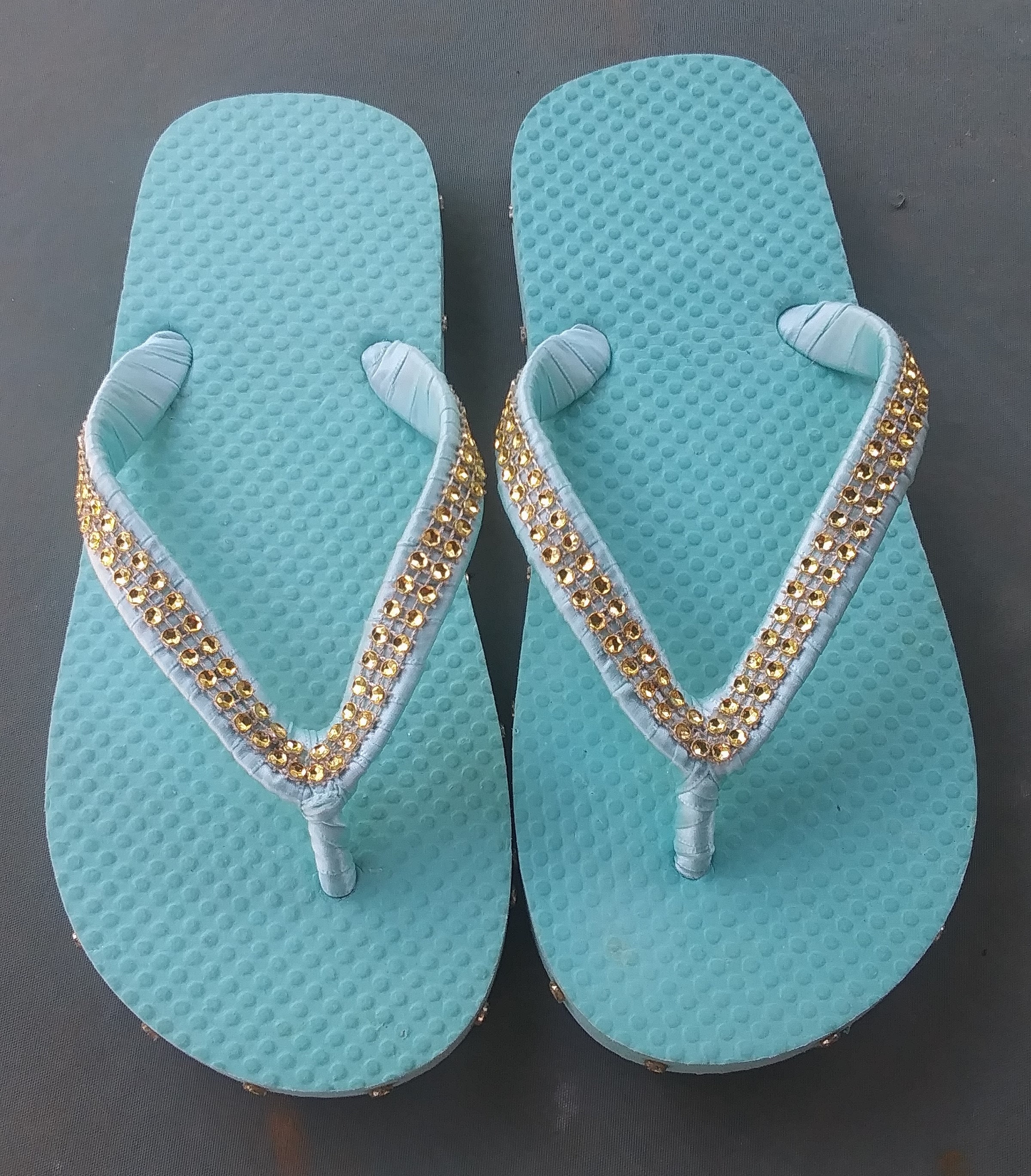 aqua colored flip flops