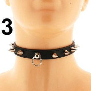 This fashion-forward choker necklace boasts a sleek design, crafted from high-quality vegan faux leather in a striking all-black hue. The adjustable buckle closure ensures a comfortable fit