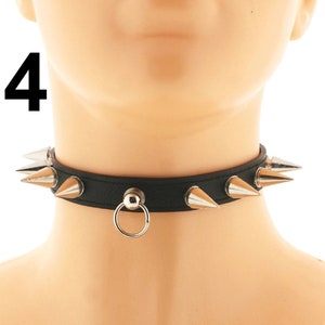 Discover our selection of black chokers designed with an adjustable buckle closure and vegan faux leather. Embrace a punk or rock aesthetic with edgy spiked details.