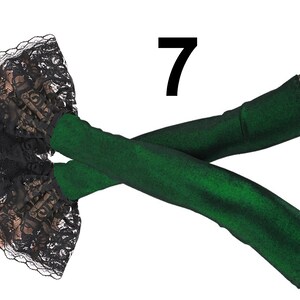 Embrace the allure of these extra-long fingerless gloves in a stunning lurex green and black design. These arm warmers are not only fashionable but also functional, providing warmth and style in one.