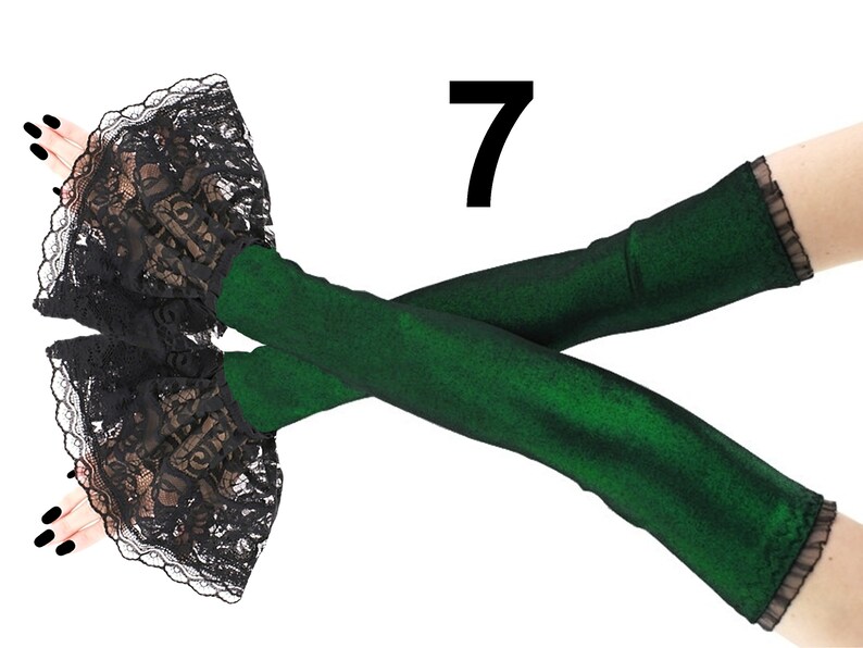 Embrace the allure of these extra-long fingerless gloves in a stunning lurex green and black design. These arm warmers are not only fashionable but also functional, providing warmth and style in one.