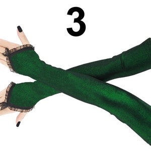 Step into the spotlight with these captivating extra-long fingerless gloves. The lurex green and black color scheme adds a touch of allure to these arm warmers, making them a perfect choice for those who want to make a statement.