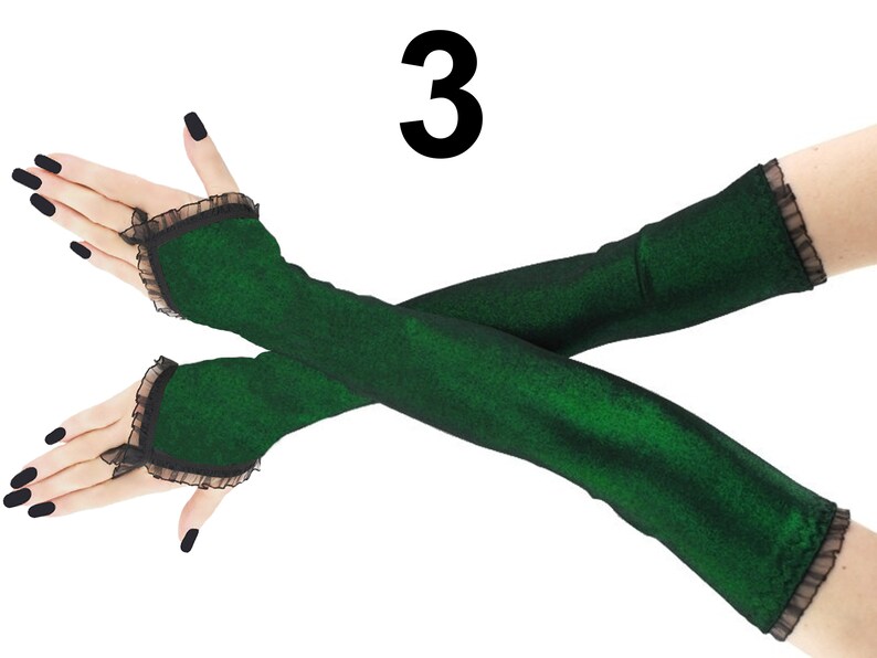 Step into the spotlight with these captivating extra-long fingerless gloves. The lurex green and black color scheme adds a touch of allure to these arm warmers, making them a perfect choice for those who want to make a statement.