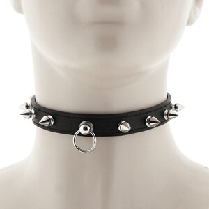 choker collar with hanging ring and spikes with a buckle closure necklace made of all black faux leather for a stylish punk or rock look