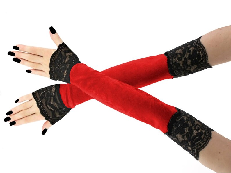 Immerse yourself in a world of luxury with our extraordinary collection of extra long velvet fingerless gloves. Designed for the discerning fashion connoisseur, these exquisite accessories boast stylish front piping and extend elegantly up the arm.