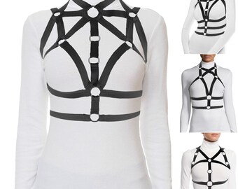 the black top with a bodycage design and crisscross stretch straps is a trendy fashion style for a modern look