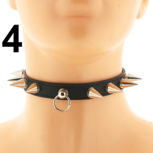 Unleash your inner rebel with our fashionable black choker. Made of vegan faux leather, it boasts a sleek ring detail and a punk rock inspired design with spikes. The adjustable buckle closure ensures a comfortable fit
