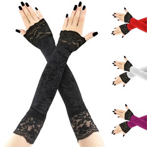 Discover our collection of elegant velvet all black fingerless gloves. These extra long gloves are perfect for evening wear, extending up the arm and featuring stylish front piping.