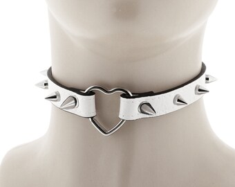 trendy punk or rock choker crafted of all white faux leather spiked with a heart ring necklace finished with an adjustable buckle closure