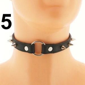 Take a look at our assortment of black chokers that have an edgy vibe, all in black. They come with an adjustable buckle closure and are made from vegan faux leather. These chokers are ideal for achieving a punk or rock-inspired look