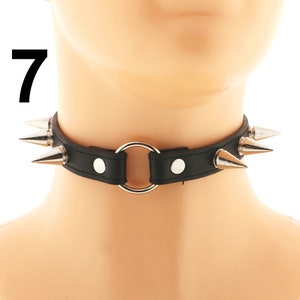 Take your style to the next level with our Black Vegan Leather Spiked Punk Choker. This collar necklace for women combines faux leather, spikes, and a trendy ring for a punk-inspired look.