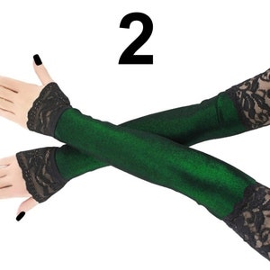 These extra long fingerless gloves are the epitome of style and sophistication. Crafted with meticulous attention to detail, they feature a stunning front piping in a mesmerizing lurex green and black design.